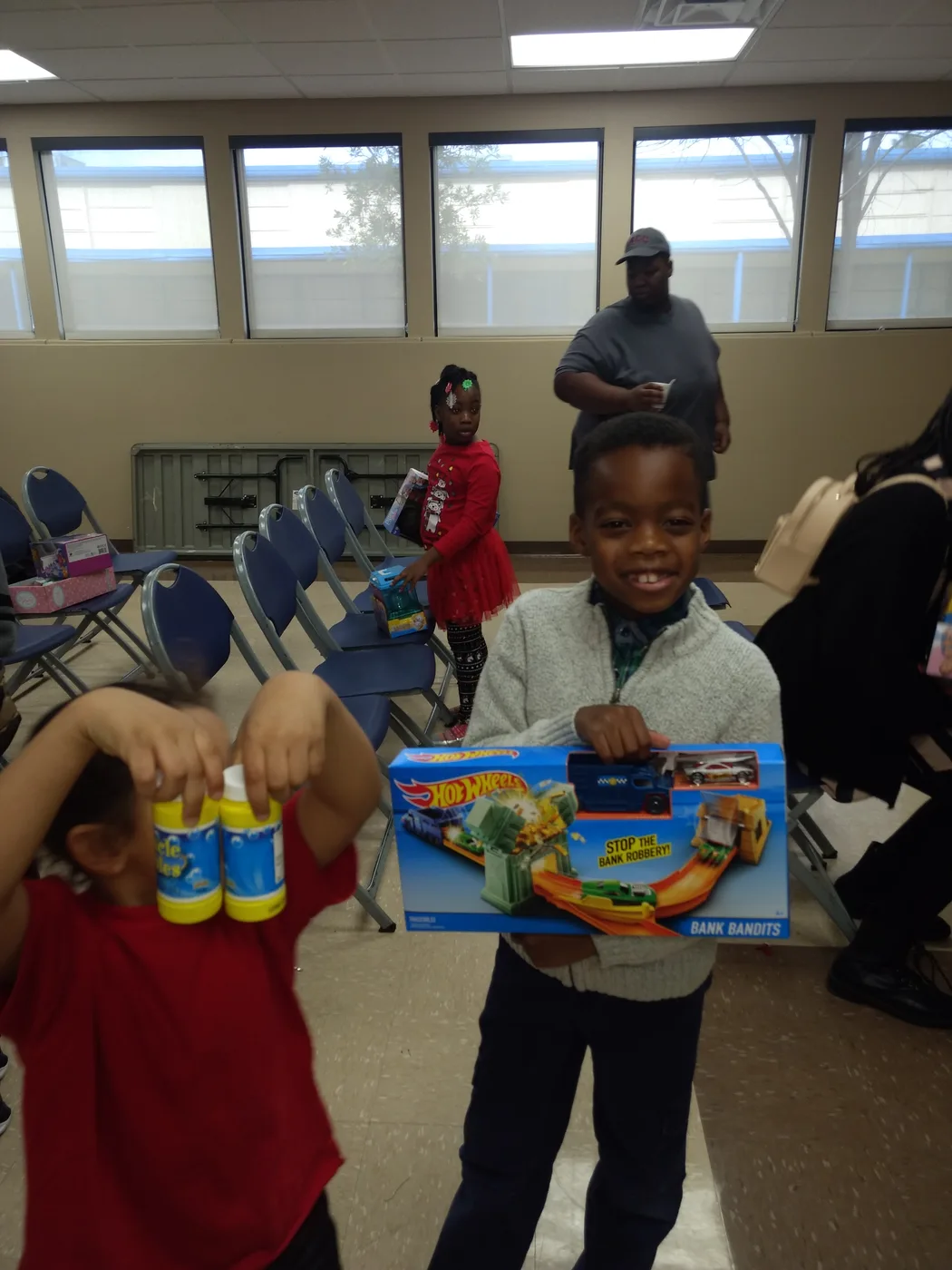 Children receiving gifts during Hope 4 You holiday outreach